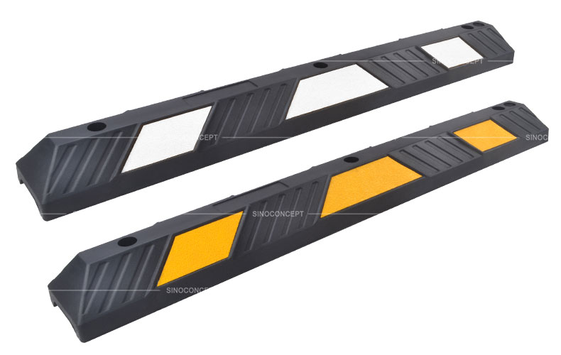 Two black parking wheel stops, one with white reflective films, and the other with yellow reflective films, manufactured by Sino Concept.