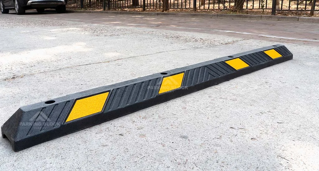 A black parking curb with yellow reflective glass bead films made of plastic-rubber composite material.